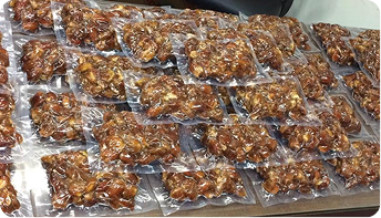 "Vacuum sealed nuts and dried fruits in clear barrier packaging bags for freshness preservation"